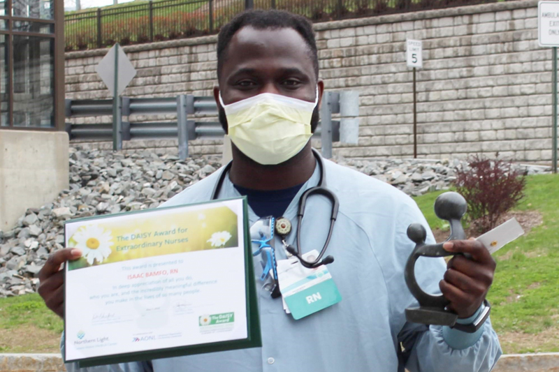 male nurse holding certificate